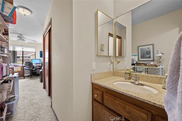bathroom featuring ceiling fan and vanity