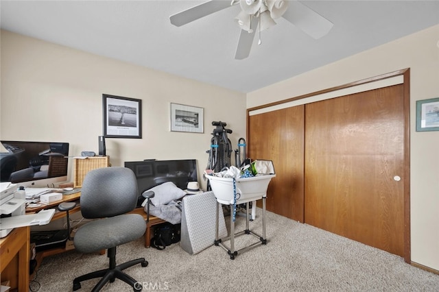office area with carpet floors and a ceiling fan