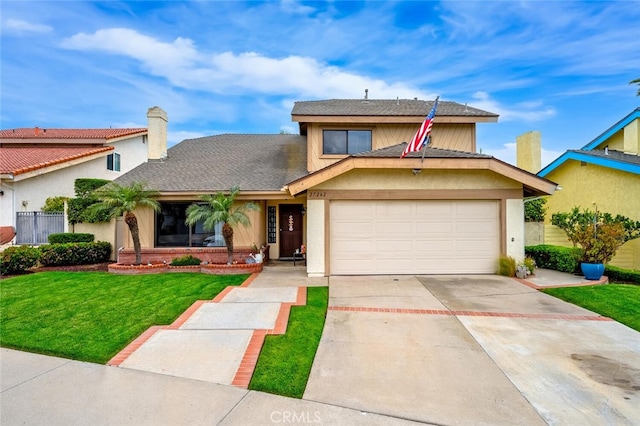 traditional-style home with a front lawn, driveway, a garage, and stucco siding