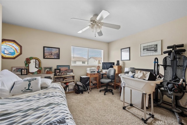 bedroom with carpet floors, a desk, and ceiling fan
