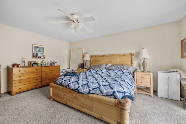 carpeted bedroom featuring a ceiling fan