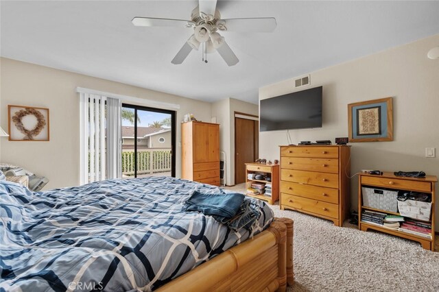 carpeted bedroom featuring access to exterior, a closet, and ceiling fan