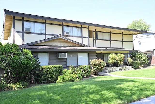 25258 Taylor St, Loma Linda, CA 92354 - view of front of house featuring a front lawn and a wall mounted AC