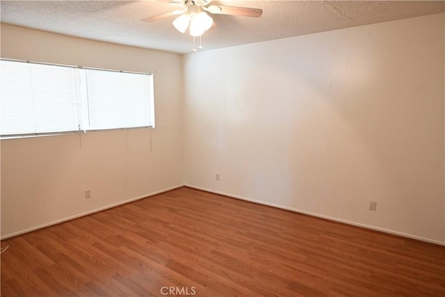 25258 Taylor St, Loma Linda, CA 92354 - spare room featuring wood finished floors, ceiling fan, baseboards, and a textured ceiling