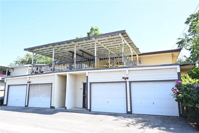 25258 Taylor St, Loma Linda, CA 92354 - view of front of property featuring stucco siding, a balcony, and a garage
