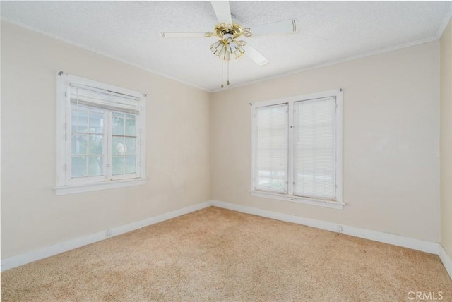 6016 Wilson Ave, South Gate, CA 90280 - spare room featuring carpet flooring, ceiling fan, baseboards, ornamental molding, and a textured ceiling