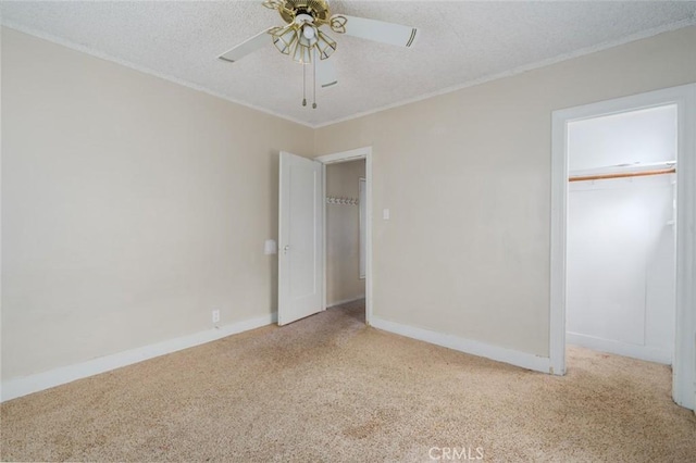 6016 Wilson Ave, South Gate, CA 90280 - unfurnished bedroom featuring carpet flooring, ornamental molding, baseboards, a textured ceiling, and ceiling fan