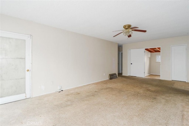 6016 Wilson Ave, South Gate, CA 90280 - empty room featuring carpet and a ceiling fan