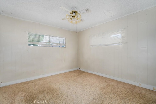 6016 Wilson Ave, South Gate, CA 90280 - carpeted empty room featuring a textured ceiling, a ceiling fan, and baseboards