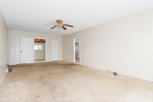 6016 Wilson Ave, South Gate, CA 90280 - empty room with a ceiling fan and carpet