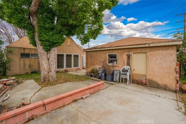 6016 Wilson Ave, South Gate, CA 90280 - rear view of property featuring a patio area and stucco siding