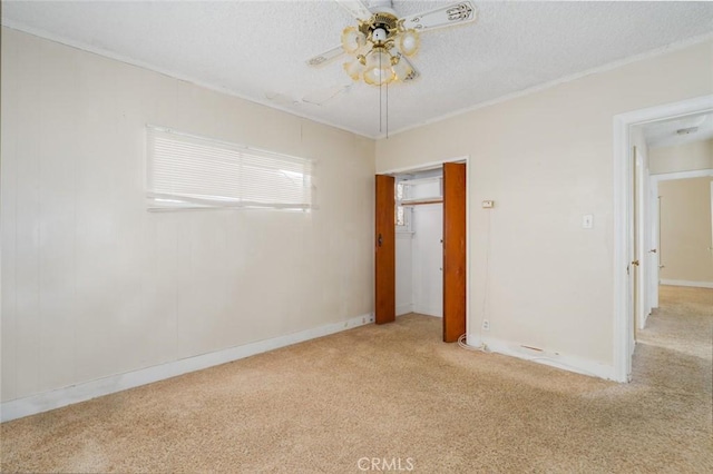 6016 Wilson Ave, South Gate, CA 90280 - unfurnished bedroom with carpet flooring, a closet, a textured ceiling, baseboards, and crown molding