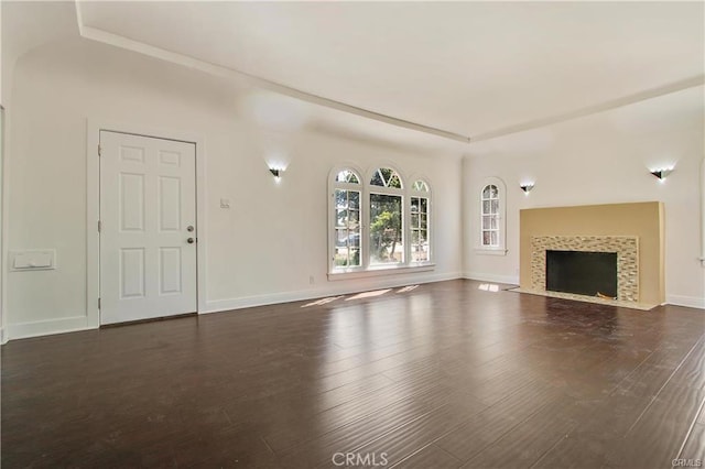 443 W Tichenor St, Compton, CA 90220 - unfurnished living room with dark wood-type flooring, baseboards, and a tiled fireplace