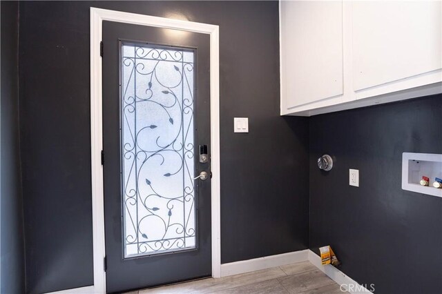 entrance foyer featuring baseboards and light wood-style floors
