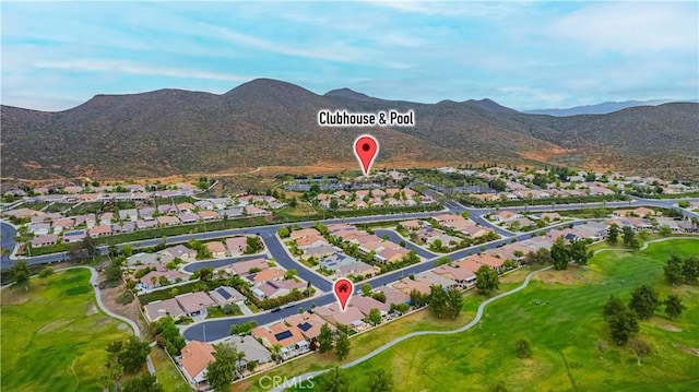 view of property location with nearby suburban area and mountains
