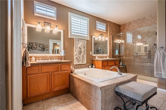 bathroom with tile patterned floors, a shower stall, healthy amount of natural light, and a whirlpool tub