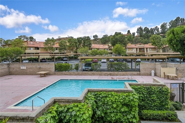community pool with a patio area