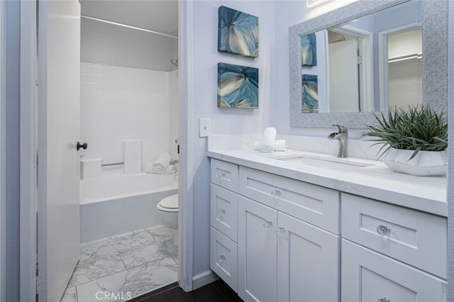 bathroom with marble finish flooring, toilet, vanity, and shower / tub combination