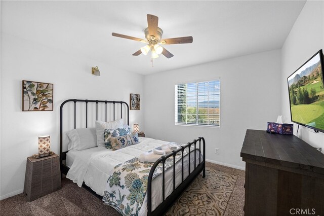 bedroom featuring carpet, baseboards, and ceiling fan