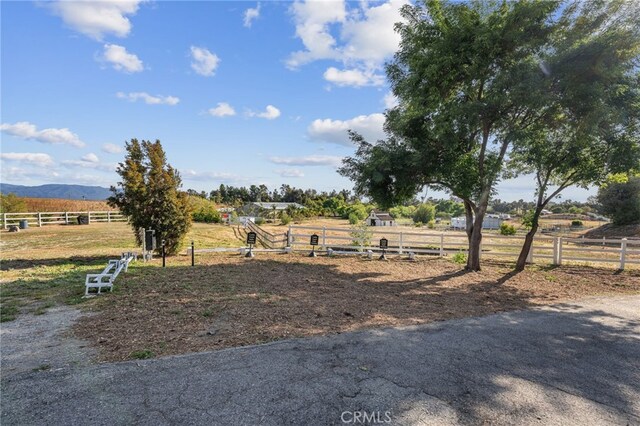 view of yard with fence and a view of countryside