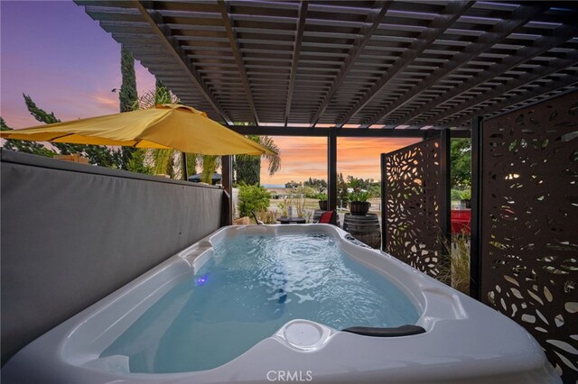 view of pool at dusk
