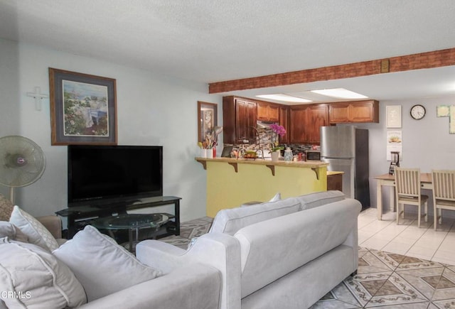 4578 Saviers Rd, Oxnard, CA 93033 - living area with a textured ceiling and light tile patterned floors
