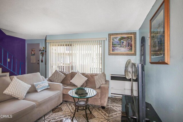4578 Saviers Rd, Oxnard, CA 93033 - living area with stairway and a textured ceiling