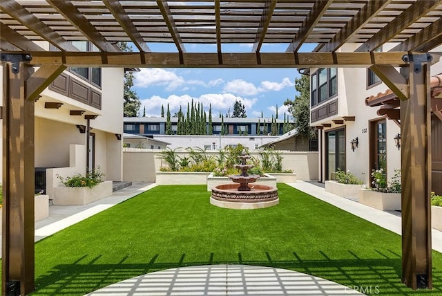 view of yard with a pergola and a patio