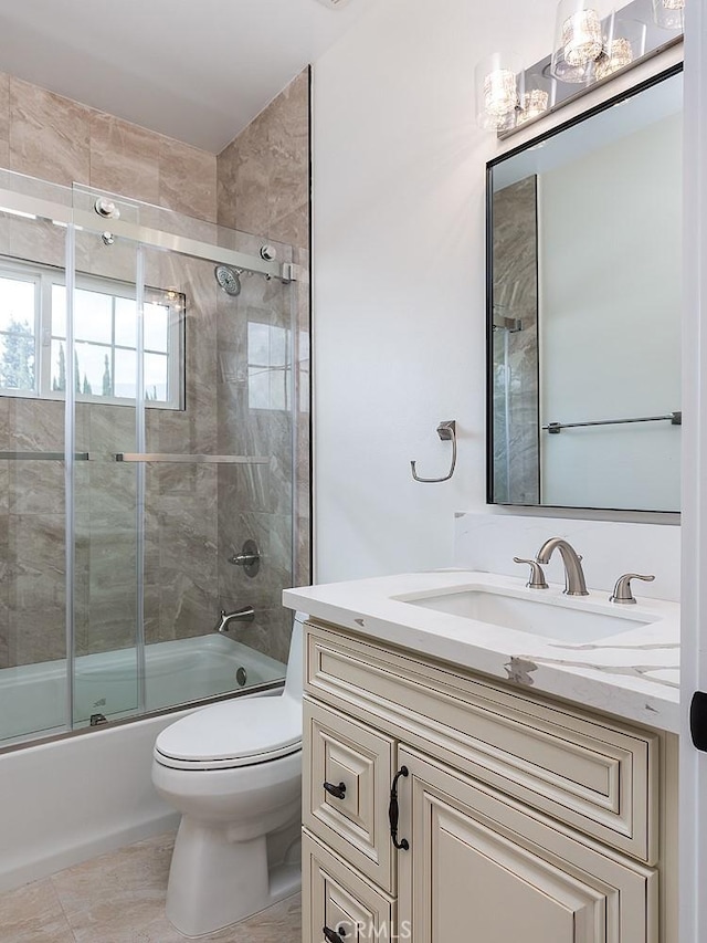 full bath with toilet, combined bath / shower with glass door, vanity, and tile patterned flooring