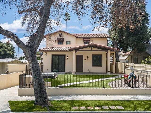 89 N Grand Oaks Ave Unit 104, Pasadena, CA 91107 - mediterranean / spanish home featuring stucco siding, a tile roof, and a gate