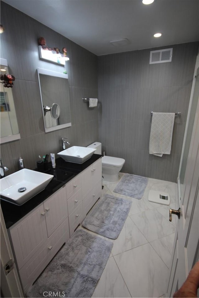 220 S Guadalupe Ave Unit 5, Redondo Beach, CA 90277 - full bath featuring marble look tile flooring, tile walls, double vanity, and recessed lighting