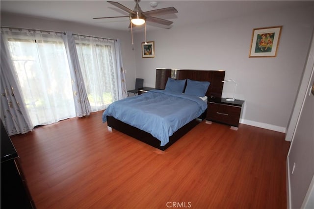 220 S Guadalupe Ave Unit 5, Redondo Beach, CA 90277 - bedroom featuring wood finished floors, baseboards, and ceiling fan
