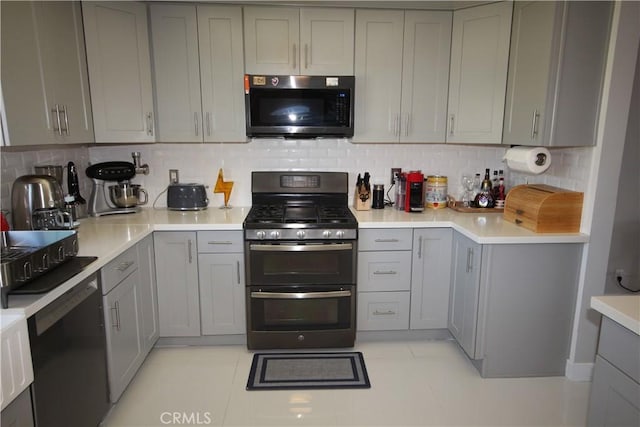 220 S Guadalupe Ave Unit 5, Redondo Beach, CA 90277 - kitchen featuring range with two ovens, gray cabinets, and tasteful backsplash