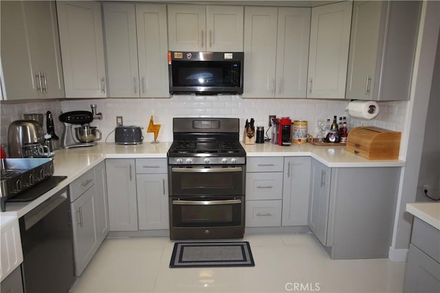 220 S Guadalupe Ave Unit 5, Redondo Beach, CA 90277 - kitchen with range with two ovens, gray cabinets, and decorative backsplash