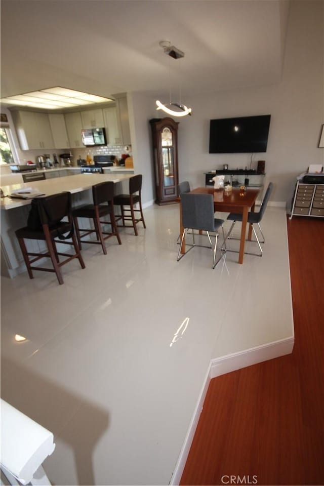220 S Guadalupe Ave Unit 5, Redondo Beach, CA 90277 - dining room with baseboards