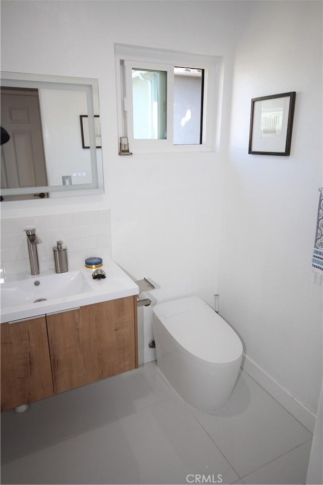 220 S Guadalupe Ave Unit 5, Redondo Beach, CA 90277 - half bath with decorative backsplash, vanity, and toilet