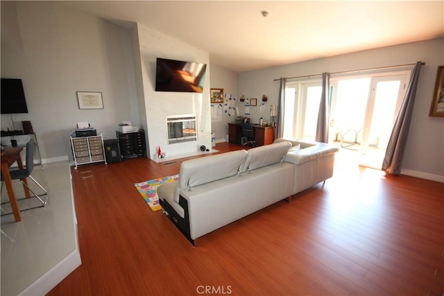 220 S Guadalupe Ave Unit 5, Redondo Beach, CA 90277 - living room featuring wood finished floors, a glass covered fireplace, and baseboards
