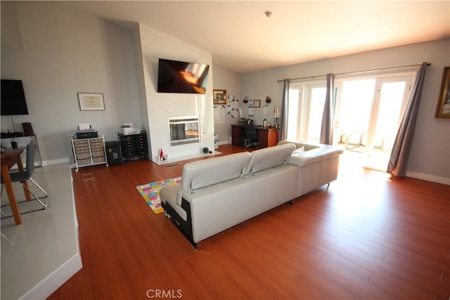 220 S Guadalupe Ave Unit 5, Redondo Beach, CA 90277 - living room with wood finished floors, a fireplace, and baseboards