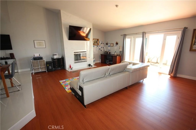 220 S Guadalupe Ave Unit 5, Redondo Beach, CA 90277 - living area featuring wood finished floors and a glass covered fireplace