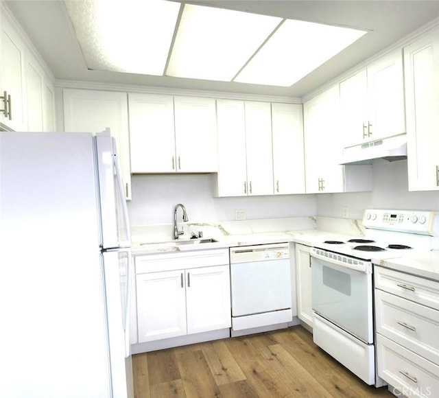 6990 Caminito Perico, San Diego, CA 92119 - kitchen with white appliances, under cabinet range hood, white cabinets, light wood-style floors, and light stone countertops