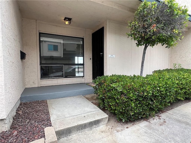6990 Caminito Perico, San Diego, CA 92119 - property entrance with stucco siding