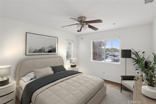 bedroom featuring carpet flooring, ceiling fan, and baseboards