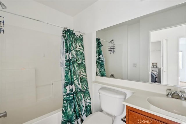 bathroom with washer / clothes dryer, curtained shower, vanity, and toilet