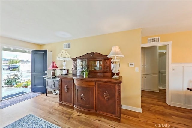 foyer entrance with light wood finished floors
