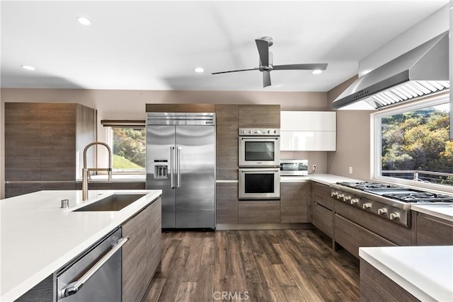 561 S Ventu Park Rd, Newbury Park, CA 91320 - kitchen with stainless steel appliances, modern cabinets, light countertops, wall chimney range hood, and recessed lighting