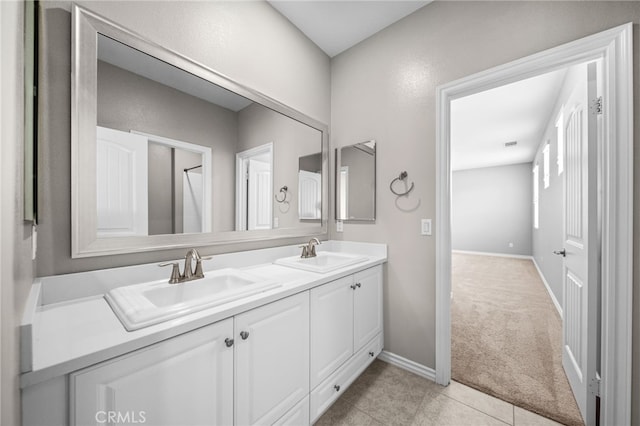 33378 Barmetta Ln, Temecula, CA 92592 - bathroom featuring double vanity, baseboards, and tile patterned flooring