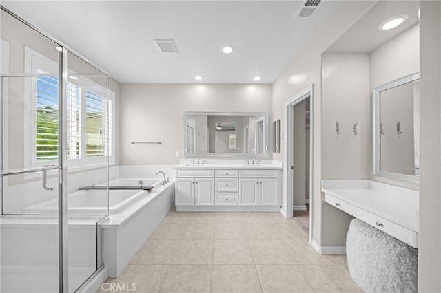 33378 Barmetta Ln, Temecula, CA 92592 - full bathroom featuring a bath, tile patterned floors, double vanity, a shower stall, and recessed lighting