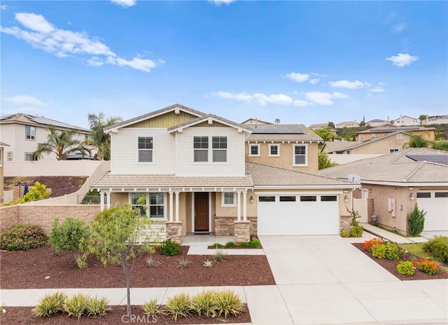 33378 Barmetta Ln, Temecula, CA 92592 - craftsman-style house featuring a porch, a garage, roof mounted solar panels, fence, and stone siding