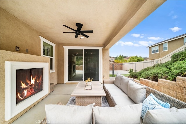 33378 Barmetta Ln, Temecula, CA 92592 - view of patio with fence, a ceiling fan, and an outdoor living space with a fireplace