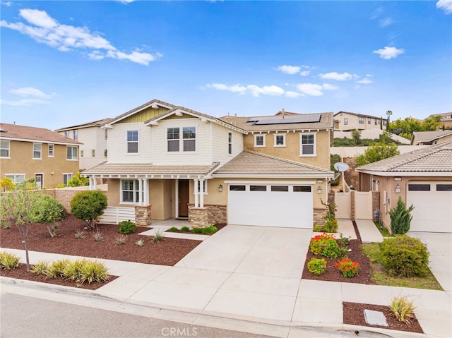 33378 Barmetta Ln, Temecula, CA 92592 - view of front facade featuring fence, solar panels, driveway, stucco siding, and stone siding